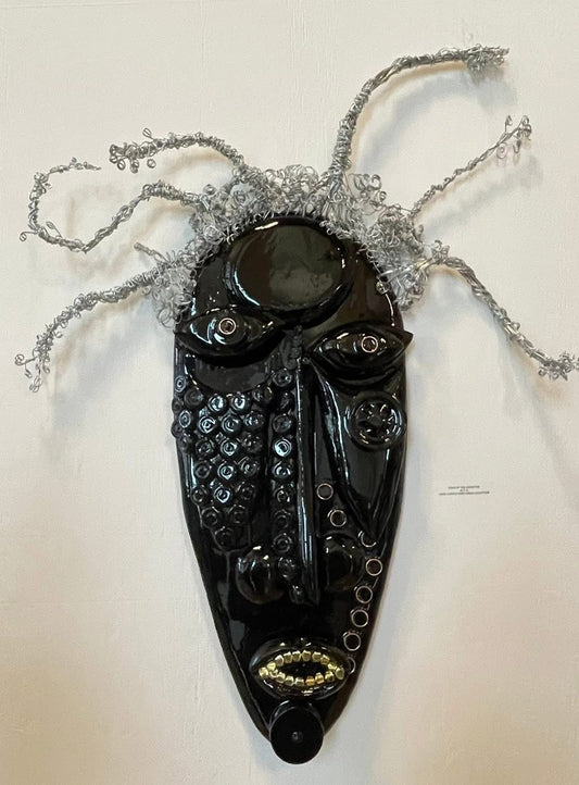 Black mask with decorative elements on a white background